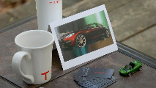 Tesla Teases Model S Customers With Gift Bag, Fancy Hat